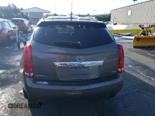 2014 Cadillac SRX Premium Collection z VIN 3GYFNGE37ES566089, wystawiony jako Copart lot #83595454 z przebiegiem 209 155 mil mil oraz Szkody całkowita. Historia ofert i sprzedaży dostępna na DreamBid. Obrazek 6.