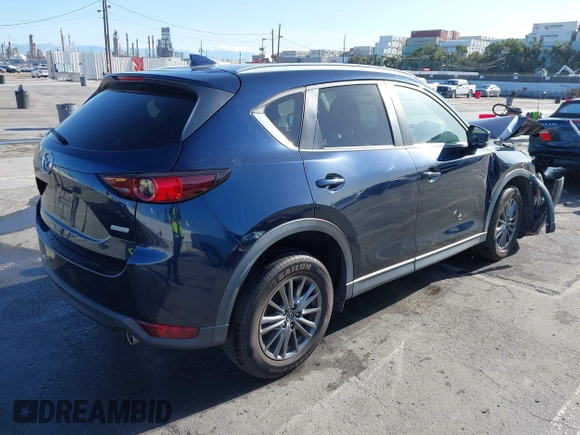 2019 Mazda CX-5 Touring with VIN JM3KFACM7K1534905, listed as a IAAI auction lot 41945607 with 56,014 mi miles. Bid and sale history available at carsss.com. Image 4.