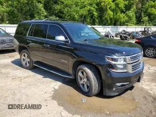 2018 Chevrolet Tahoe Premier with VIN 1GNSKCKC1JR133625, listed as a Copart auction lot 54900974 with 130,921 mi miles and Salvage title. Bid and sale history available at DreamBid. Image 4.