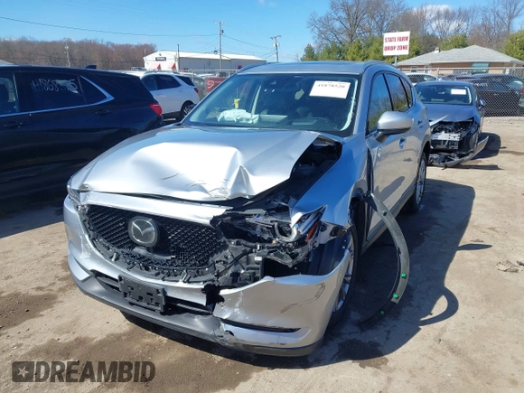 2021 Mazda CX-5 Grand Touring with VIN JM3KFBDM3M1300316, listed as a IAAI auction lot 41878520 with 77,670 mi miles and . Bid and sale history available at DreamBid. Image 6.