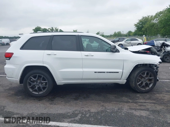 2021 Jeep Grand Cherokee 80th Anniversary with VIN 1C4RJFBG2MC568028, listed as a IAAI auction lot 42381104 with 51,027 mi miles and . Bid and sale history available at DreamBid. Image 13.