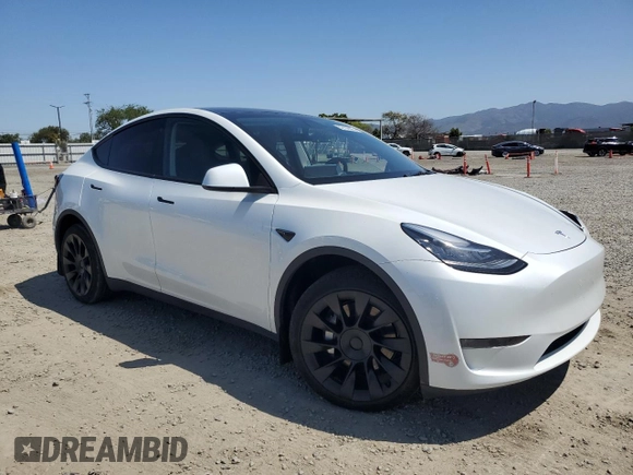 2023 Tesla Model Y Long Range z VIN 7SAYGDEE2PA061792, wystawiony jako Copart lot #52106965 z przebiegiem 11 968 mil mil oraz Szkoda całkowita • Salvage title. Historia ofert i sprzedaży dostępna na DreamBid. Obrazek 4.
