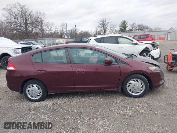 2011 Honda Insight LX z VIN JHMZE2H52BS004304, wystawiony jako IAAI lot #41827541 z przebiegiem 141 072 mil mil oraz . Historia ofert i sprzedaży dostępna na DreamBid. Obrazek 13.