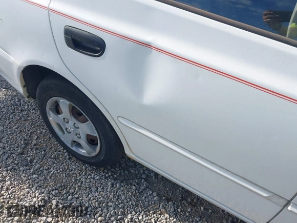 2002 Hyundai Accent GL with VIN KMHCG45C92U347708, listed as a IAAI auction lot 42137086 with 73,271 mi miles. Bid and sale history available at carsss.com. Image 13.