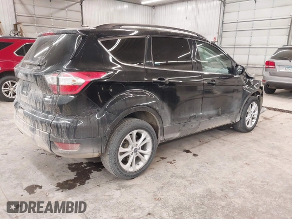 2018 Ford Escape SE z VIN 1FMCU9GD0JUC25636, wystawiony jako IAAI lot #40996760 z przebiegiem 70 097 mil mil oraz . Historia ofert i sprzedaży dostępna na DreamBid. Obrazek 4.