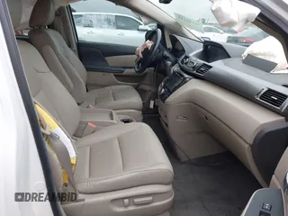 2014 Honda Odyssey Touring with VIN 5FNRL5H95EB059729, listed as a IAAI auction lot 42148110 with 135,304 mi miles and . Bid and sale history available at DreamBid. Image 5.