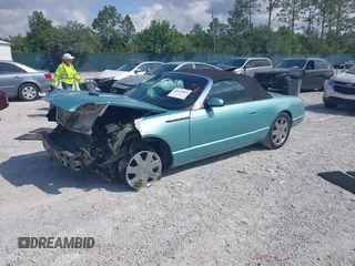 2003 Ford Thunderbird Deluxe z VIN 1FAHP60A33Y110451, wystawiony jako IAAI lot #42133863 z przebiegiem Nie podano mil oraz . Historia ofert i sprzedaży dostępna na DreamBid. Obrazek 2.