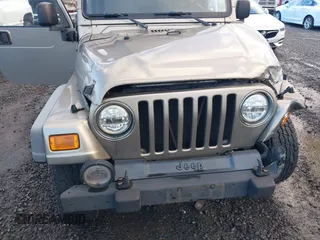2004 Jeep Wrangler Sport with VIN 1J4FA49S94P711531, listed as a IAAI auction lot 41306863 with 143,720 mi miles and . Bid and sale history available at DreamBid. Image 18.