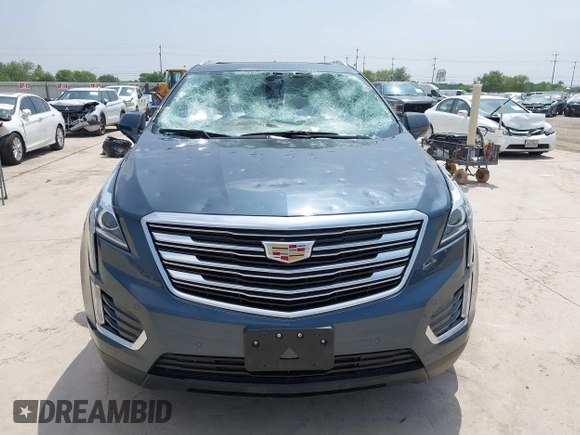 2019 Cadillac XT5 Luxury FWD z VIN 1GYKNCRS1KZ259282, wystawiony jako IAAI lot #41921030 z przebiegiem 27 880 mil mil oraz . Historia ofert i sprzedaży dostępna na DreamBid. Obrazek 12.