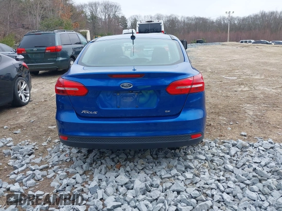2018 Ford Focus SE z VIN 1FADP3F25JL255840, wystawiony jako IAAI lot #41852913 z przebiegiem 64 010 mil mil oraz . Historia ofert i sprzedaży dostępna na DreamBid. Obrazek 16.