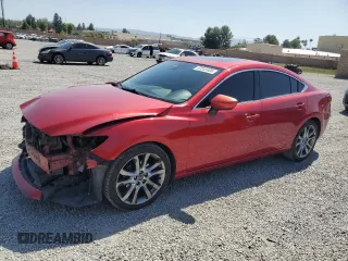 2014 Mazda 6 i Grand Touring с VIN JM1GJ1W64E1121399, выставлен на аукционе Copart как лот 57513405 с пробегом 161 286 миль миль и Списание • Salvage title. История ставок и продаж доступна на DreamBid. Изображение 1.
