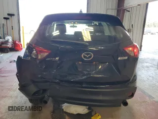 2016 Mazda CX-5 Sport with VIN JM3KE4BY1G0870166, listed as a Copart auction lot 60433035 with 93,433 mi miles and Salvage title. Bid and sale history available at DreamBid. Image 6.