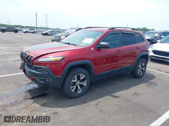 2014 Jeep Cherokee Trailhawk with VIN 1C4PJMBS7EW162357, listed as a IAAI auction lot 42601903 with 104,768 mi miles and . Bid and sale history available at DreamBid. Image 2.