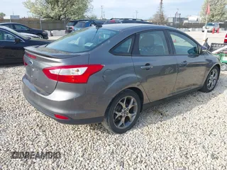 2013 Ford Focus SE with VIN 1FADP3F22DL117712, listed as a IAAI auction lot 42131439 with 124,327 mi miles. Bid and sale history available at carsss.com. Image 4.