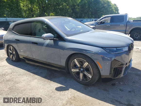 2022 BMW iX xDrive50 с VIN WB523CF00NCK44547, выставлен на аукционе Copart как лот 55262775 с пробегом 22 664 миль миль и Списание • Salvage title. История ставок и продаж доступна на DreamBid. Изображение 4.