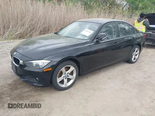 2014 BMW 3 Series 320i xDrive with VIN WBA3C3G5XENS68374, listed as a IAAI auction lot 42042243 with 107,830 mi miles. Bid and sale history available at carsss.com. Image 2.