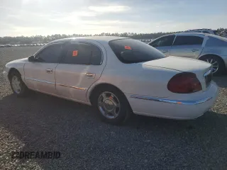 2000 Lincoln Continental with VIN 1LNHM97V0YY795279, listed as a Copart auction lot 76456684 with 0 mi miles and Salvage Title. Bid and sale history available at carsss.com. Image 2.