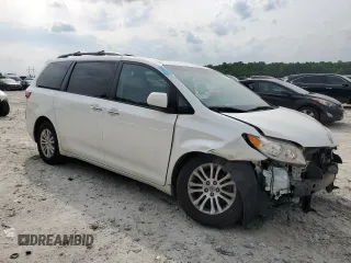 2016 Toyota Sienna XLE with VIN 5TDYK3DC3GS730639, listed as a Copart auction lot 57379935 with 105,323 mi miles and Salvage title. Bid and sale history available at DreamBid. Image 4.