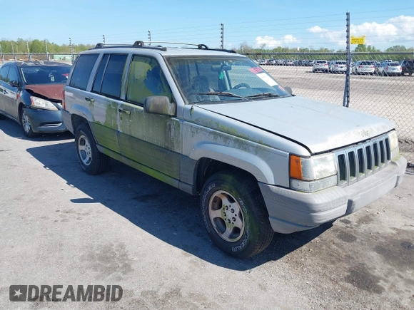 1996 Jeep Grand Cherokee Laredo with VIN 1J4FX58S2TC397006, listed as a IAAI auction lot 41836108 with 136,742 mi miles. Bid and sale history available at carsss.com. Image 1.