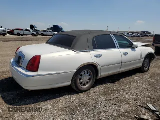 2001 Lincoln Town Car Cartier z VIN 1LNHM83W91Y728971, wystawiony jako Copart lot #50643965 z przebiegiem Nie podano mil oraz Szkoda całkowita • Salvage title. Historia ofert i sprzedaży dostępna na DreamBid. Obrazek 3.