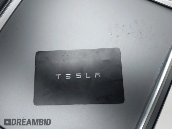 2022 Tesla Model 3 Long Range with VIN 5YJ3E1EB0NF129945, listed as a IAAI auction lot 41965531 with 59,162 mi miles and . Bid and sale history available at DreamBid. Image 11.
