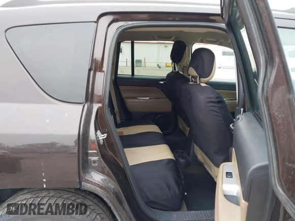 2014 Jeep Compass Latitude with VIN 1C4NJDEB5ED731057, listed as a IAAI auction lot 41938769 with 175,289 mi miles and . Bid and sale history available at carsss.com. Image 8.