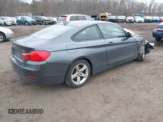 2014 BMW 4 Series 428i xDrive with VIN WBA3N9C50EK246002, listed as a IAAI auction lot 41612256 with 100,915 mi miles and . Bid and sale history available at carsss.com. Image 4.