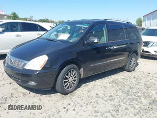 2011 Kia Sedona EX with VIN KNDMH4C76B6398261, listed as a IAAI auction lot 41894696 with 180,297 mi miles. Bid and sale history available at carsss.com. Image 2.