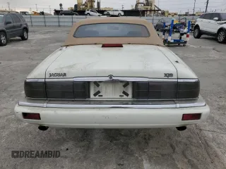 1994 Jaguar XJS with VIN SAJNX2749RC191243, listed as a Copart auction lot 76037994 with 74,842 mi miles and Salvage Title. Bid and sale history available at carsss.com. Image 6.