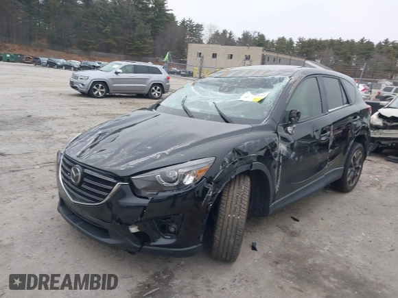 2016 Mazda CX-5 Grand Touring with VIN JM3KE4DY1G0685449, listed as a IAAI auction lot 41162840 with 134,525 mi miles. Bid and sale history available at carsss.com. Image 2.