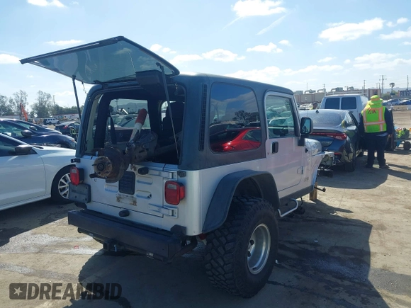 2004 Jeep Wrangler Rubicon with VIN 1J4FA69S94P701660, listed as a IAAI auction lot 41699554 with 74,640 mi miles. Bid and sale history available at carsss.com. Image 4.