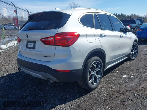 2019 BMW X1 xDrive28i with VIN WBXHT3C58K5N05523, listed as a IAAI auction lot 41752675 with 63,861 mi miles. Bid and sale history available at carsss.com. Image 4.