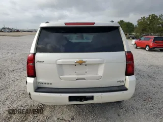 2015 Chevrolet Tahoe LT with VIN 1GNSCBKC9FR220574, listed as a Copart auction lot 54788555 with 244,491 mi miles and Salvage title. Bid and sale history available at DreamBid. Image 6.