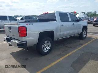 2017 Chevrolet Silverado 1500 LT with VIN 3GCUKREC5HG285689, listed as a IAAI auction lot 42055959 with 128,237 mi miles and . Bid and sale history available at DreamBid. Image 4.