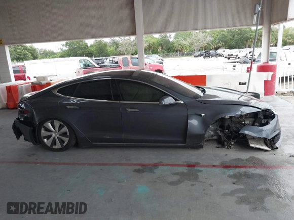 2021 Tesla Model S Long Range Plus with VIN 5YJSA1E28MF421655, listed as a IAAI auction lot 42407234 with 111,443 mi miles and . Bid and sale history available at DreamBid. Image 13.