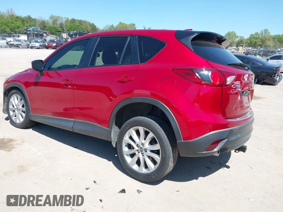 2015 Mazda CX-5 Grand Touring with VIN JM3KE4DY5F0469439, listed as a IAAI auction lot 42053851 with 70,676 mi miles. Bid and sale history available at carsss.com. Image 3.