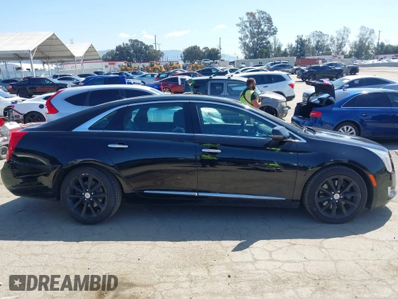 2013 Cadillac XTS Luxury z VIN 2G61P5S30D9220113, wystawiony jako IAAI lot #41970214 z przebiegiem 52 476 mil mil oraz . Historia ofert i sprzedaży dostępna na DreamBid. Obrazek 13.