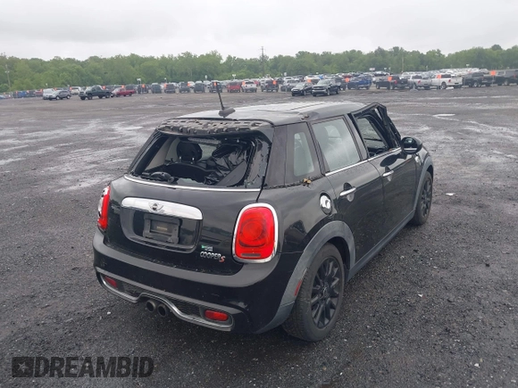 2015 MINI Hardtop 4 Door S with VIN WMWXU3C55F2B56429, listed as a IAAI auction lot 42335996 with 114,781 mi miles and . Bid and sale history available at DreamBid. Image 4.