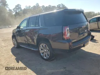 2015 GMC Yukon SLT with VIN 1GKS1BKC0FR239629, listed as a Copart auction lot 77414814 with 171,611 mi miles and Salvage Title. Bid and sale history available at carsss.com. Image 2.