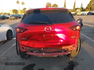2020 Mazda CX-5 Touring z VIN JM3KFACM1L0855474, wystawiony jako IAAI lot #42004504 z przebiegiem 82 505 mil mil oraz . Historia ofert i sprzedaży dostępna na DreamBid. Obrazek 16.