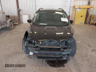2014 Ford Escape SE with VIN 1FMCU9G95EUA16328, listed as a IAAI auction lot 42464235 with 108,570 mi miles and . Bid and sale history available at DreamBid. Image 6.