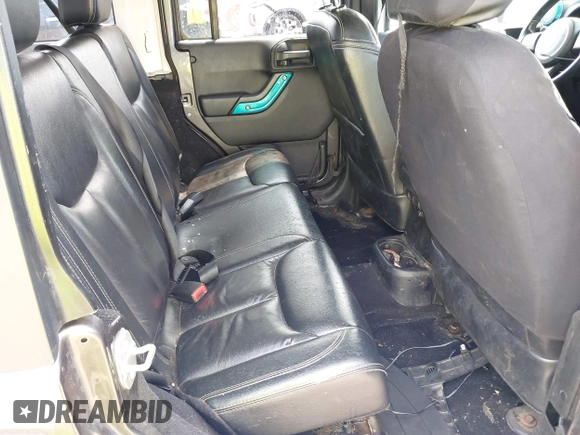 2014 Jeep Wrangler Unlimited Sahara with VIN 1C4BJWEG8EL285843, listed as a IAAI auction lot 42399090 with Not provided miles and . Bid and sale history available at DreamBid. Image 8.
