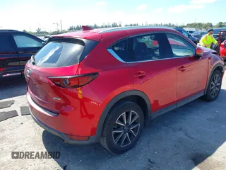 2018 Mazda CX-5 Grand Touring with VIN JM3KFADM0J0377091, listed as a IAAI auction lot 41677544 with 91,758 mi miles. Bid and sale history available at carsss.com. Image 4.
