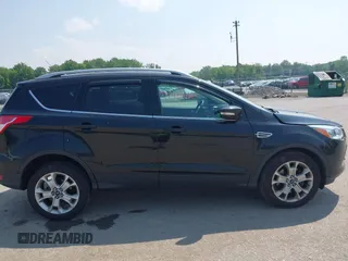 2015 Ford Escape Titanium with VIN 1FMCU9J96FUB58519, listed as a IAAI auction lot 42429369 with 125,541 mi miles and . Bid and sale history available at DreamBid. Image 13.
