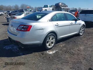 2013 Ford Taurus SEL with VIN 1FAHP2E8XDG164903, listed as a IAAI auction lot 41580690 with 163,128 mi miles and . Bid and sale history available at carsss.com. Image 4.
