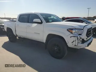 2022 Toyota Tacoma SR with VIN 3TMCZ5AN3NM506811, listed as a Copart auction lot 84630754 with 32,099 mi miles and Salvage title. Bid and sale history available at DreamBid. Image 4.