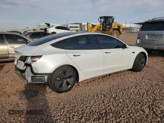 2021 Tesla Model 3 Standard Range Plus with VIN 5YJ3E1EA2MF923156, listed as a Copart auction lot 50098135 with 50,917 mi miles and Salvage Title. Bid and sale history available at carsss.com. Image 3.
