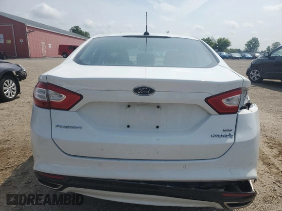 2013 Ford Fusion SE Hybrid z VIN 3FA6P0LU7DR245720, wystawiony jako Copart lot #60231425 z przebiegiem 249 180 mil mil oraz Czysty tytuł • Clean title. Historia ofert i sprzedaży dostępna na DreamBid. Obrazek 6.