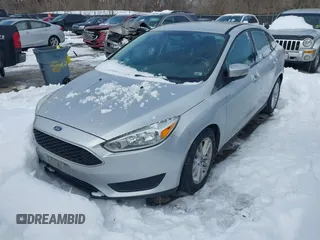 2015 Ford Focus SE z VIN 1FADP3F26FL357140, wystawiony jako IAAI lot #41256854 z przebiegiem 194 812 mil mil oraz . Historia ofert i sprzedaży dostępna na DreamBid. Obrazek 2.