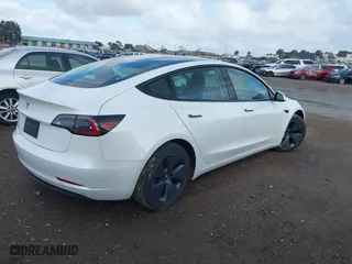 2023 Tesla Model 3 with VIN 5YJ3E1EA4PF405361, listed as a IAAI auction lot 41932723 with 28,487 mi miles. Bid and sale history available at carsss.com. Image 4.